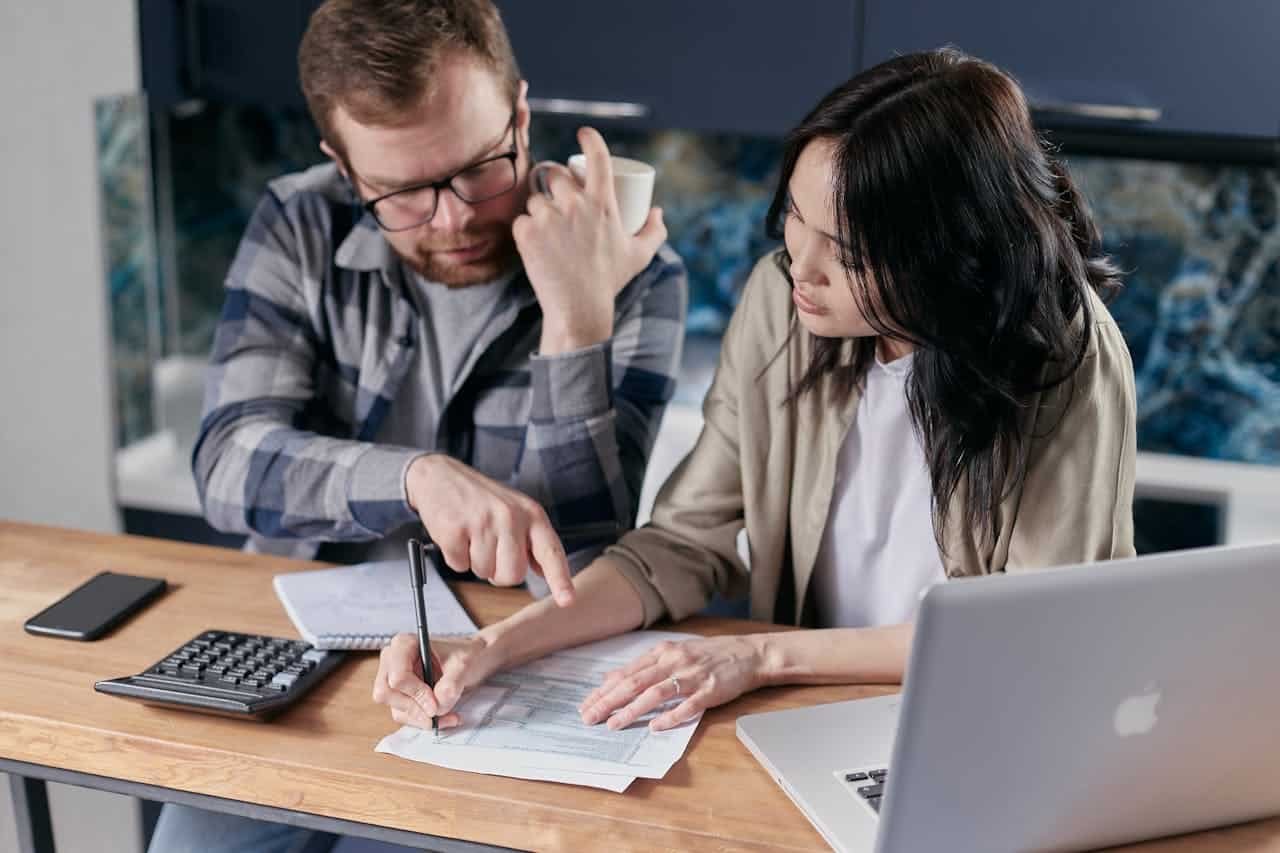 Couple calculating their bills and debts