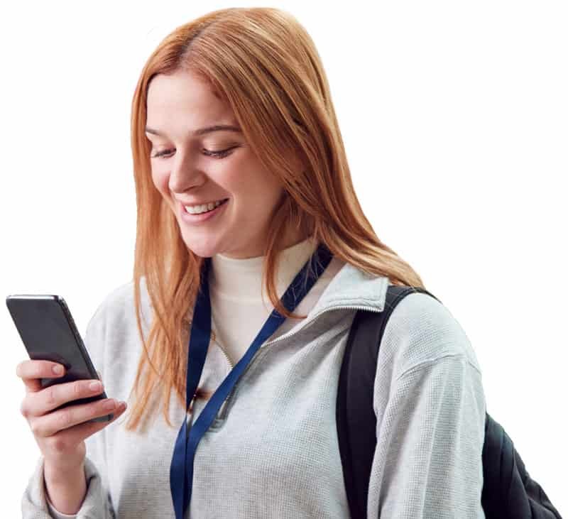 Woman checks phone smiling