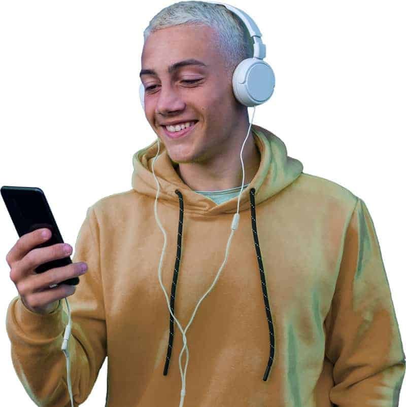 A person with headphones smiling at a phone